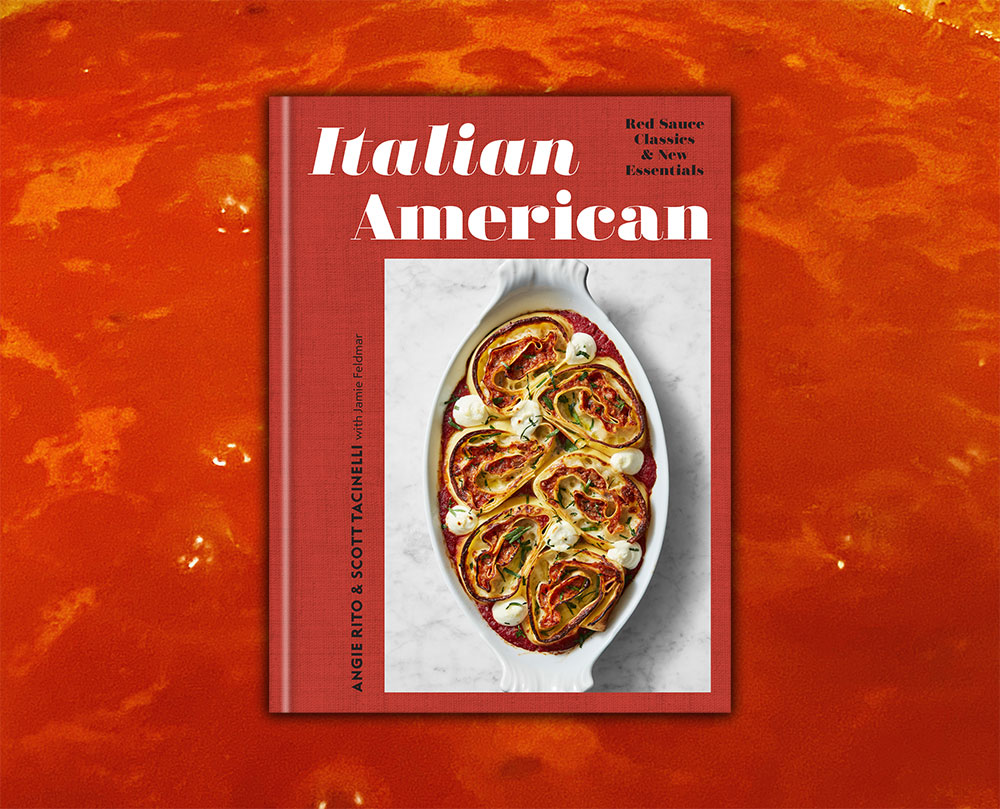 Italian American cookbook with sauce on the background