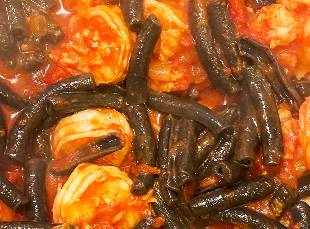 Shrimp Fra Diavolo with squid ink pasta -- tomato sauce and black pasta