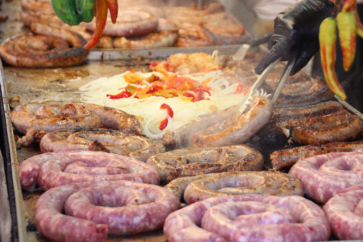 sausages grilling at the Feast of San Gennaro in 2022