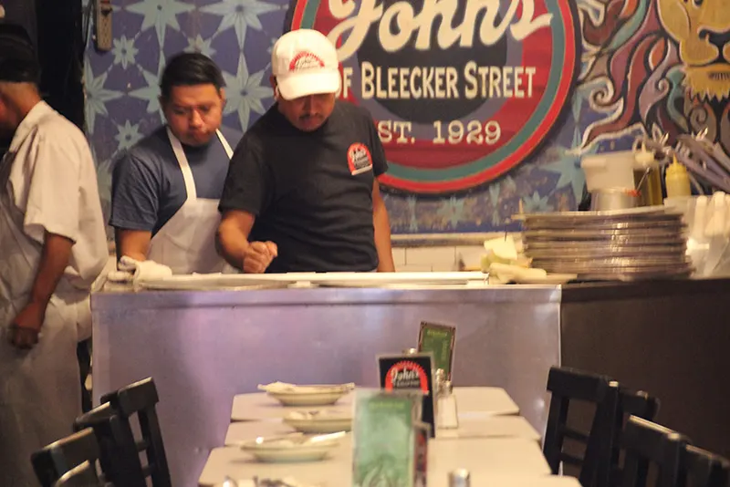John's of Bleecker since 1929, a pizzaiolo makes pizza