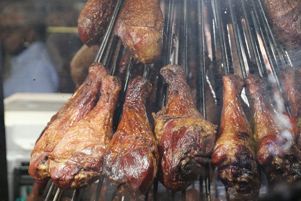 legs of meat roasting at San Gennaro